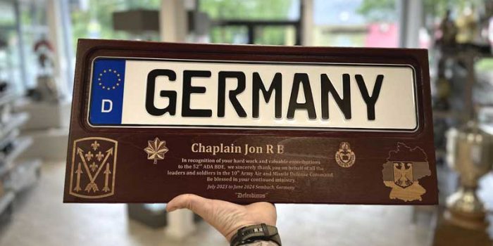 License Plate Plaque Dark Wood 52d ADA BDE Chaplain Award | Trophy Center Kulbick | Trophy Shop | Engraving Shop | ONLY in Kaiserslautern-Einsiedlerhof underneath Hacienda Mexican Restaurant | 2 MILES FROM RAMSTEIN AIR BASE | Engraving Custom Made Coin Challenge Coins Stamps Embroidery Guidons Awards Plaques Trophies Engraving Plaque Shop Graveur Gravur  | Stempel Gravuren Pokale Schilder | USAREUR-AF | USAFE  AFAFRICA | Nato | USAFRICOM  |  EUCOM  |  AFRICOM  |  Airborne  |Special Forces | Bundeswehr | CEOs Sandra Kulbick & J.R. Kulbick  |  WE ARE NOT AFFILIATED WITH ANY STORES ON BASE  |  ONLY in K-TOWN  | We Are Awesome | E-Mail: info@trophy-center.de